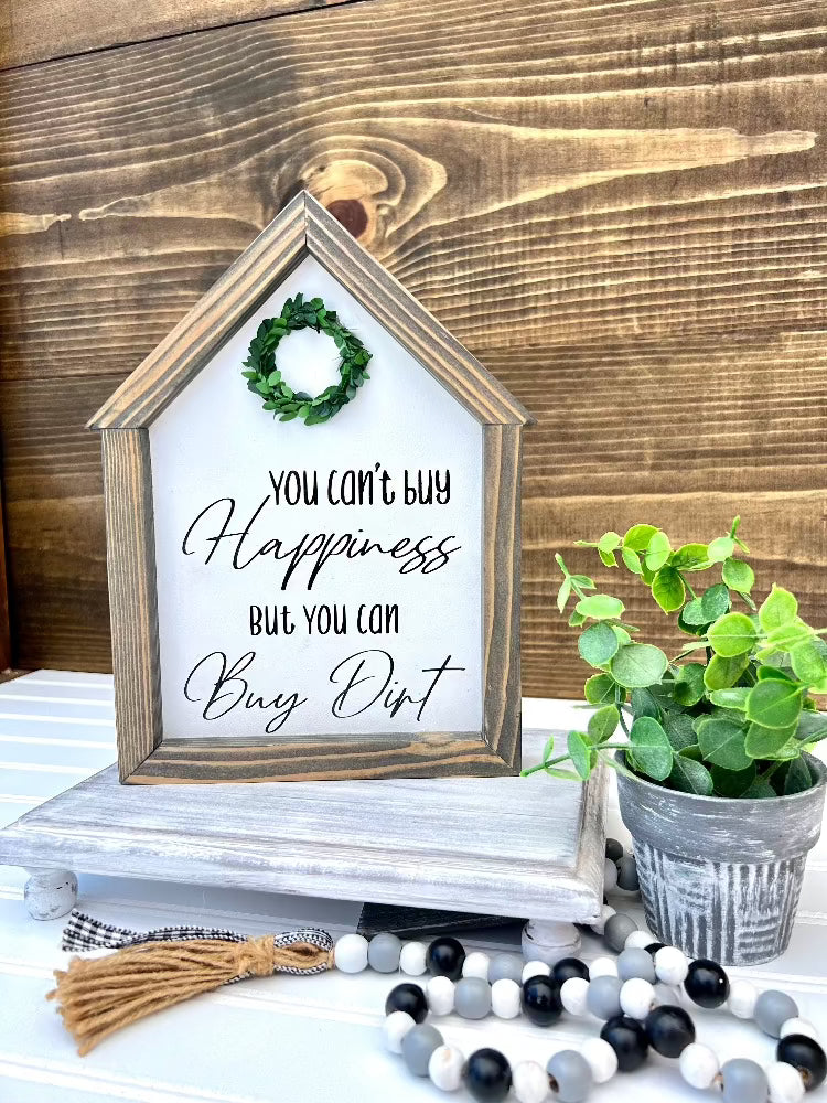 You can't buy Happiness, but you can buy Dirt, House shaped sign.