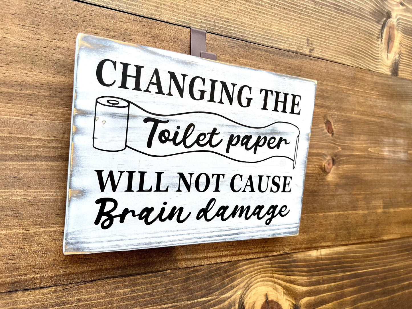 Changing the toilet paper will not cause brain damage wood sign for bathroom